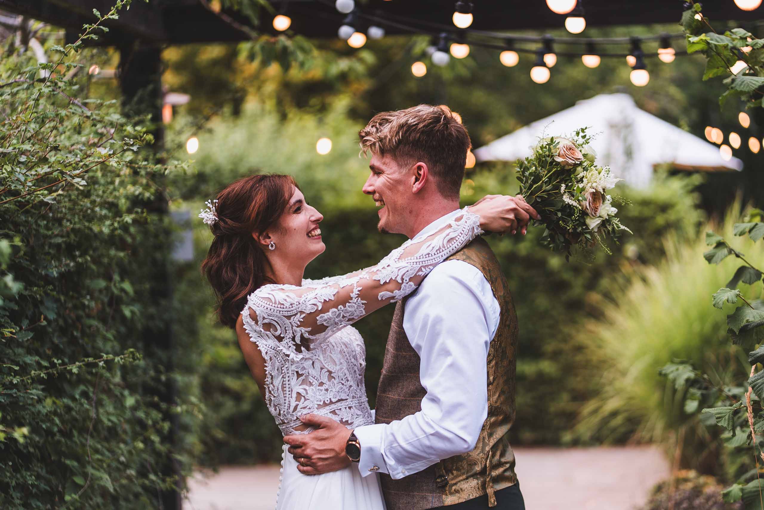 Bride and groomfirst dance in the garden