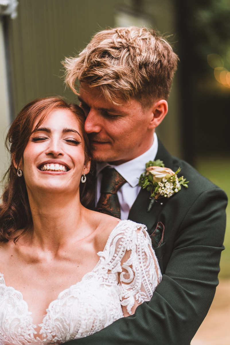 Loving embrace from the happy newly weds