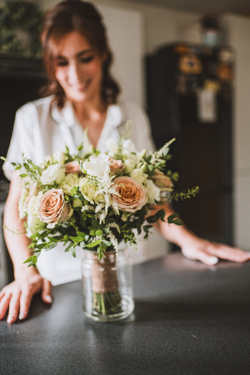 Bride looking at her wedding bouquet