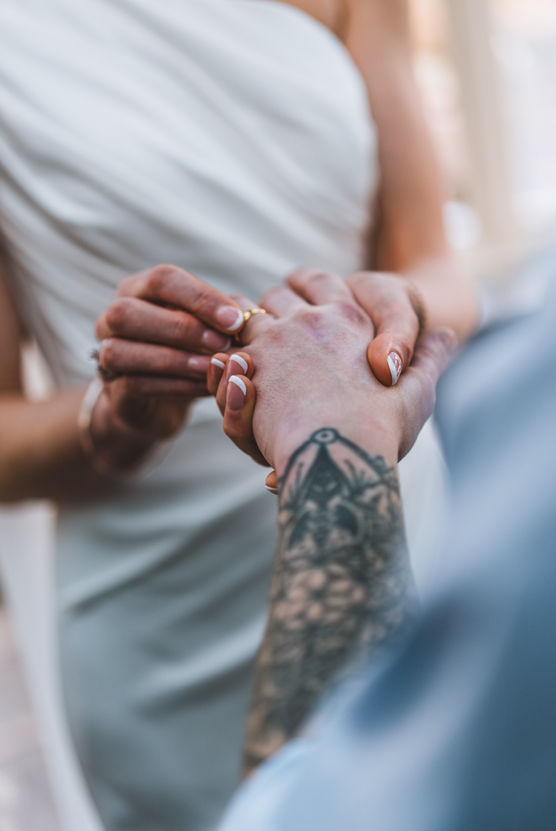 Close-up of a wedding ring being placed during the ceremony